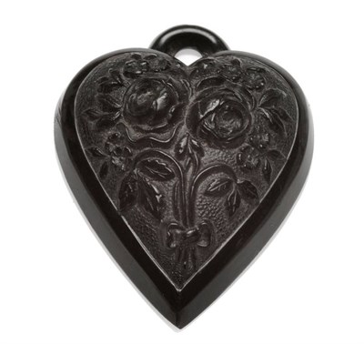 Lot 445 - A Victorian Jet Pendant, the heart shaped pendant carved with a tied floral motif within a polished