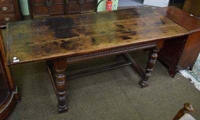 Lot 1414 - An 18th century and later oak refectory table