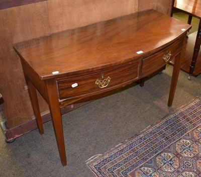 Lot 1418 - A George III mahogany bow fronted side table fitted with two drawers