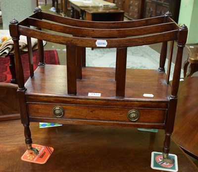 Lot 1427 - A mahogany three division Canterbury moving on brass casters