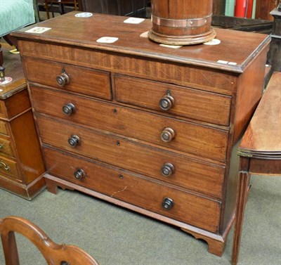 Lot 1431 - A George III mahogany four height chest of drawers with later handles