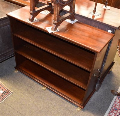 Lot 1440 - A mahogany bookcase with brass claw feet