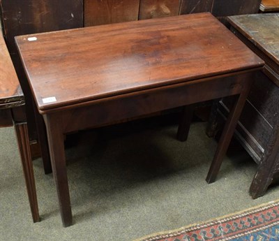 Lot 1442 - A George III mahogany fold over card table