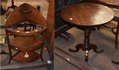 Lot 1449 - A George III circular oak tripod table and a mahogany corner washstand of similar date (2)