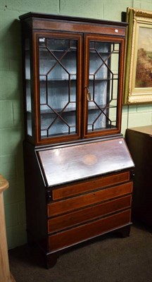 Lot 1455 - An Edwardian inlaid mahogany astragal glazed bureau bookcase