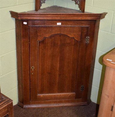 Lot 1460 - A late 18th/early 19th century oak hanging corner cupboard