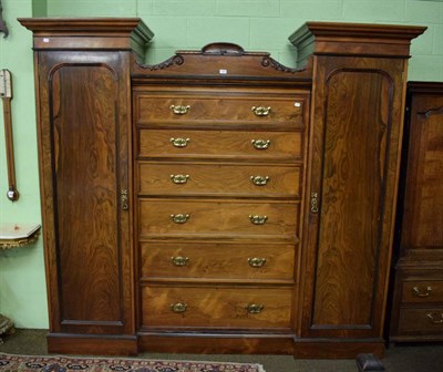 Lot 1462 - An impressive Victorian rosewood wardrobe, the twin panel doors opening to reveal hanging space and