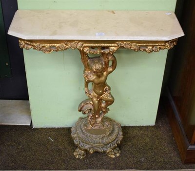 Lot 1463 - A figural gilt console table with faux marble top