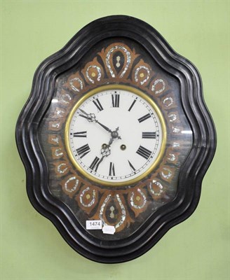 Lot 1474 - A French ebonised striking wall clock, with a mother of pearl inlaid dial surround