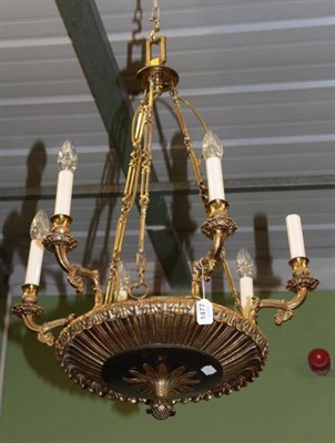 Lot 1477 - A gilt and patinated bronze six-light chandelier, 19th century, the fluted and leaf sheathed scroll