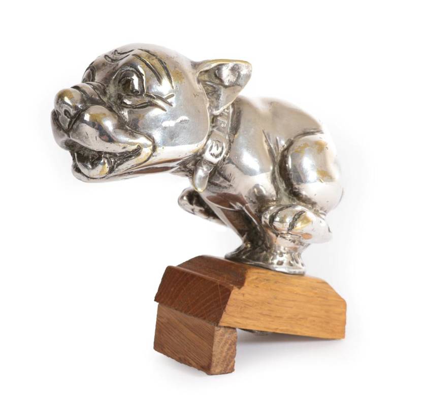 Lot 1 - A British 1930's Chrome on Brass Car Mascot "The Telcot Pup", mounted on a later wooden base, 7.5cm