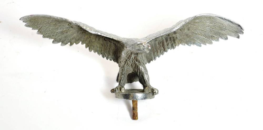 Lot 23 - A 1930's Alloy Car Mascot, as an eagle with wings outstretched, the claw feet on a circular...