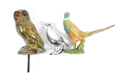 Lot 25 - Three Accessory Car Mascots, as birds, to include a brass example as an owl with orange glass...