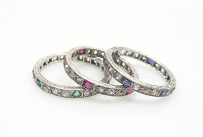 Lot 455 - Three Full Eternity Rings, one set with sapphires and diamonds (one sapphire missing), one with...