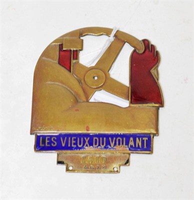 Lot 133 - A 1910 French Brass and Enamel Car Badge, designed by R Perot, of stylised form with a steering...