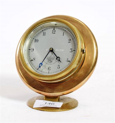 Lot 146 - A 1930's Smith's Brass Dashboard Clock, with silvered dial stamped Smiths Cricklewood Works...