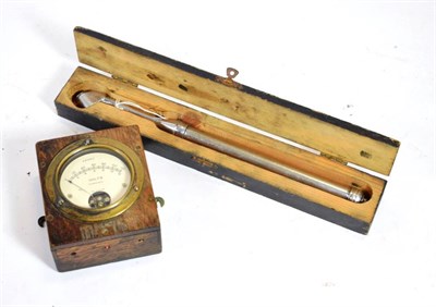Lot 147 - An Early 20th Century Marconi Brass Volt Meter, numbered END9925 Made in England, mounted in an oak