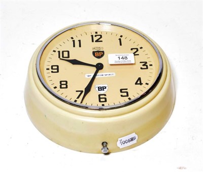 Lot 148 - A 1950's BP Motorspirit Metamec Electric Wall Clock, with cream bakelite case, salmon colour...