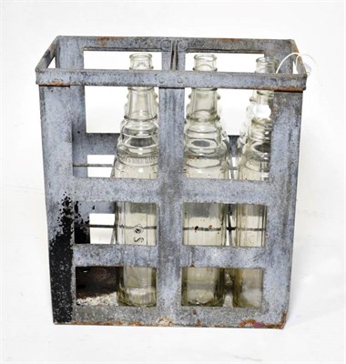 Lot 159 - A Vintage Metal Essolene Cage, containing six Esso/Essolube quartz size clear glass bottles
