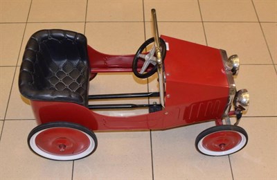 Lot 165 - A Child's Red Painted and Metal Pedal Car, modern, as a 1938 motor car with chromed roll bar...