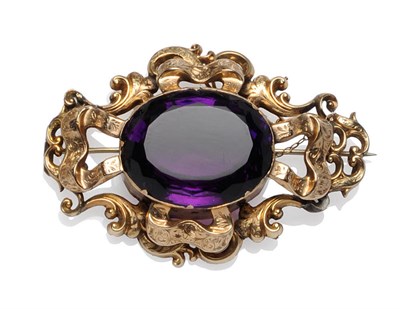 Lot 470 - A Large Victorian Amethyst Brooch, the large oval mixed cut amethyst claw set to the centre of...