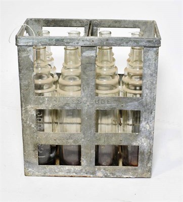 Lot 178 - A Vintage Essolube Metal Cage, containing eight Essolube 1 quart clear glass oil bottles, 37cm...