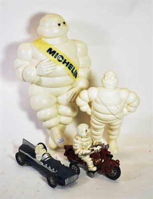 Lot 197 - A Metal Cast Michelin Advertising Figures, comprising the Michelin man with a yellow sash with blue