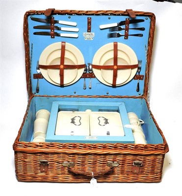 Lot 202 - Fortnum & Mason Ltd: A 1960/70 Coracle Picnic Basket, with hinged lid enclosing a two place setting