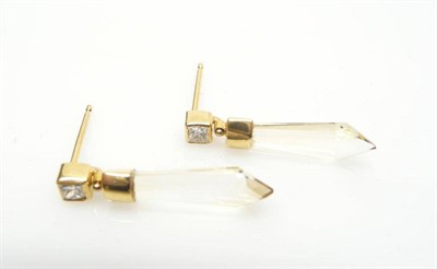 Lot 474 - A Pair of Diamond and Citrine Drop Earrings, a princess cut diamond stud suspends a faceted pointed