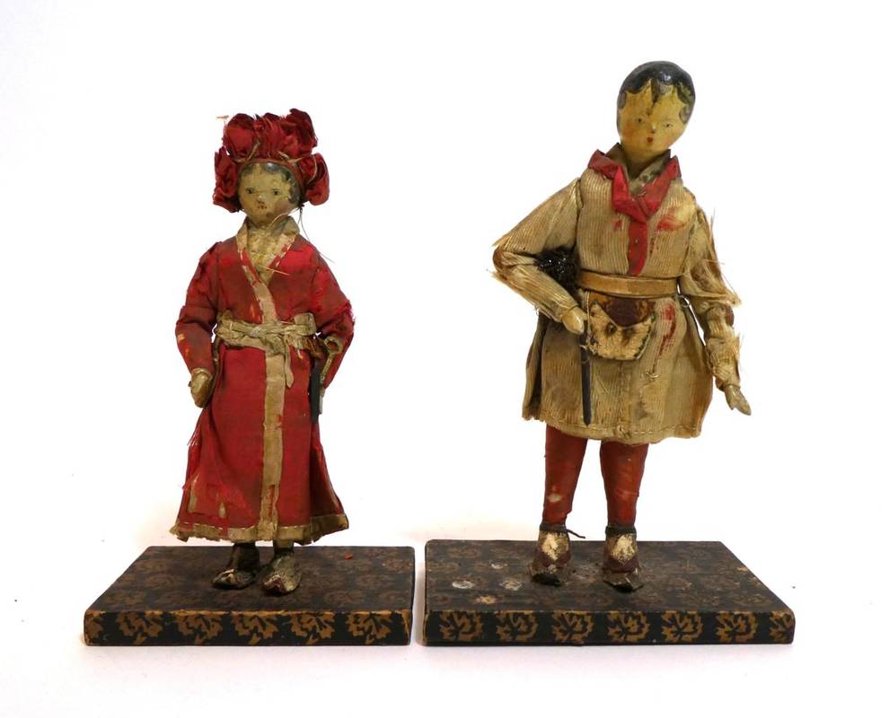 Lot 2001 - Pair of Early 19th Century Grodnertal Style Carved Wooden Dolls, with black painted hair, curls...