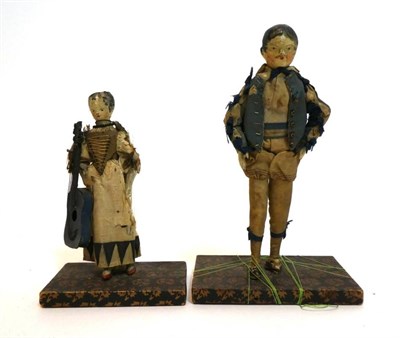 Lot 2002 - Pair of Early 19th Century Grodnertal Style Carved Wooden Dolls, with black painted hair, curls...