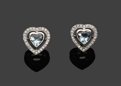 Lot 480 - A Pair of 18 Carat White Gold Aquamarine and Diamond Earrings, by Theo Fennell, a heart shaped...