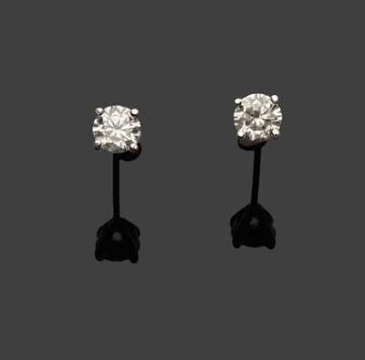 Lot 481 - A Pair of 18 Carat White Gold Diamond Solitaire Stud Earrings, the round brilliant cut diamonds...