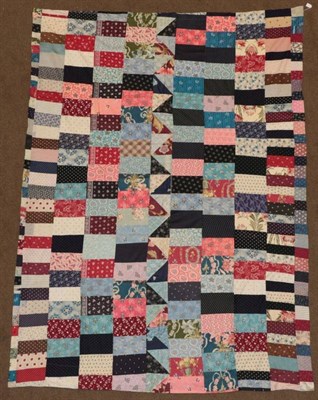 Lot 2023 - Late 19th Century Large Patchwork Cover, incorporating printed cotton designs in a variety of...