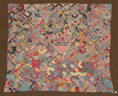 Lot 2042 - Circa 1930 African American Unfinished Patchwork Coverlet, incorporating feed sacks, shirting...