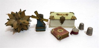 Lot 2063 - Assorted 19th Century and Later Sewing Accessories, comprising a windmill novelty tape measure made