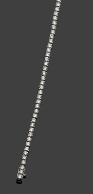 Lot 488 - A Diamond Line Bracelet, round brilliant cut diamonds in articulated claw settings, total...