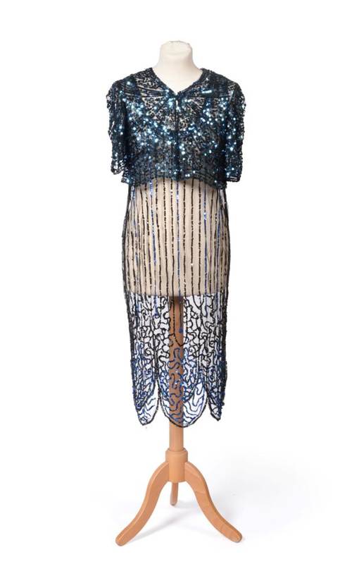 Lot 2108 - 1920s Blue and Black Sequinned and Beaded Dress, the black net ground embellished with striped...