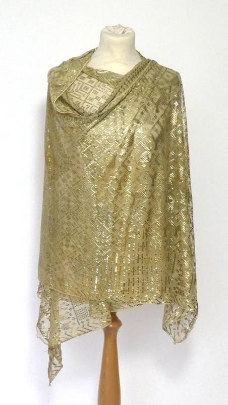 Lot 2112 - 1920s Assuit Shawl, the champagne net ground applied with a hammered metal design of camels amongst