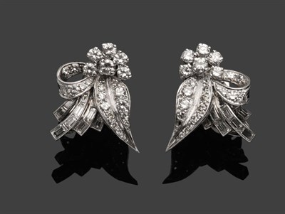 Lot 491 - A Pair of Diamond Cluster Earrings, round brilliant and baguette cut diamonds form floral spray...