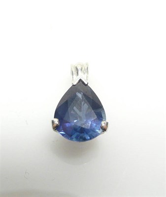 Lot 494 - A Sapphire Pendant, the pear cut sapphire held in a white claw setting, measures 0.8cm by 1.6cm