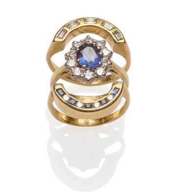 Lot 503 - An 18 Carat Gold Sapphire and Diamond Cluster Ring, within a border of round brilliant cut diamonds