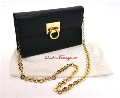 Lot 2239 - Salvatore Ferragamo Black Leather Small Shoulder Bag / Clutch, with gold tone metal long strap...