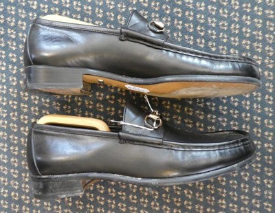 Lot 2250 - Pair of Gentleman's Gucci Black Leather Loafers, with chrome snaffle bar (size 43.5) with two...