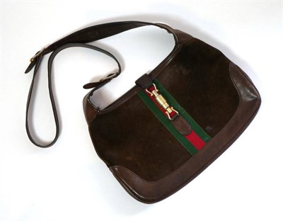 Lot 2267 - Circa 1960/70s Gucci Brown Suede and Leather Shoulder Bag, with signature green and red canvas...