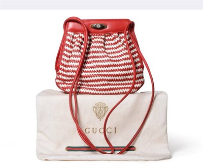 Lot 2297 - Gucci Red and Cream Leather Woven Shoulder Bag, with two-tone metal clasp stamped 'GG',...