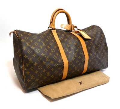 Lot 2300 - Louis Vuitton 'Keepall 55' Monogram Weekend / Overnight Bag, trimmed in tan leather, with...