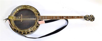 Lot 3043 - Ozark 4-String Banjo with 11'' head, mother of pearl inlay to head, decorative carving under...