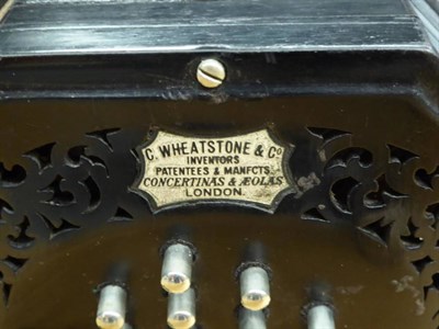 Lot 3047 - Concertina English System By C Wheatstone & Co. 56 button with black, wooden endplates,...