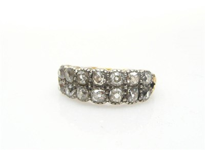 Lot 518 - A Two Row Diamond Ring, seven old brilliant cut diamonds on each row in white claw settings, to...